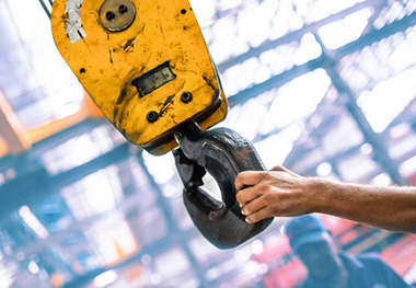 What are the causes and solutions for the hook group falling during the crane application process?