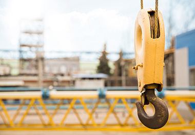 What are the functions and classifications of hooks in crane machinery?